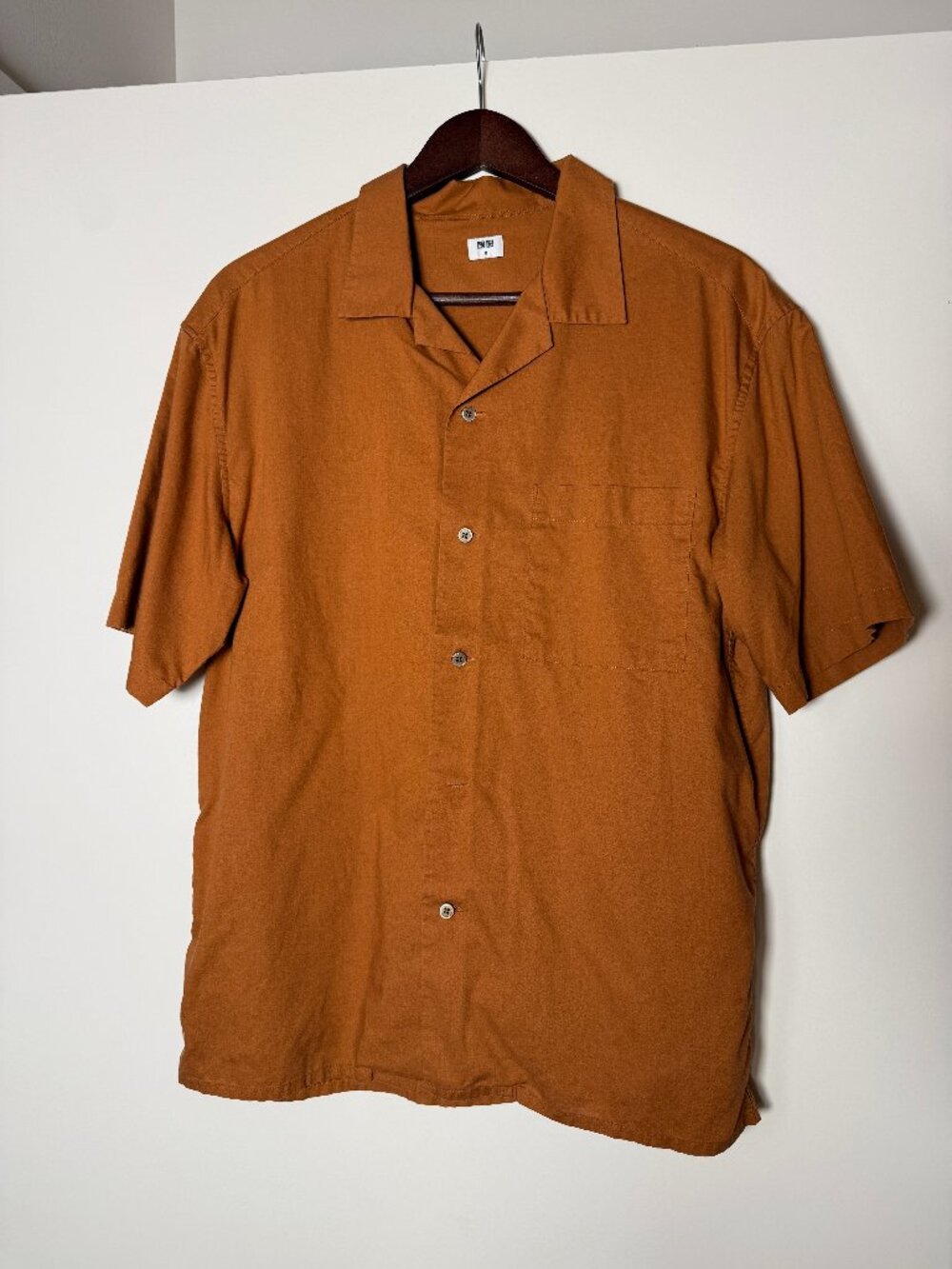 Uniqlo: Tangarine-colored and Olive-colored short-sleeve button down shirt